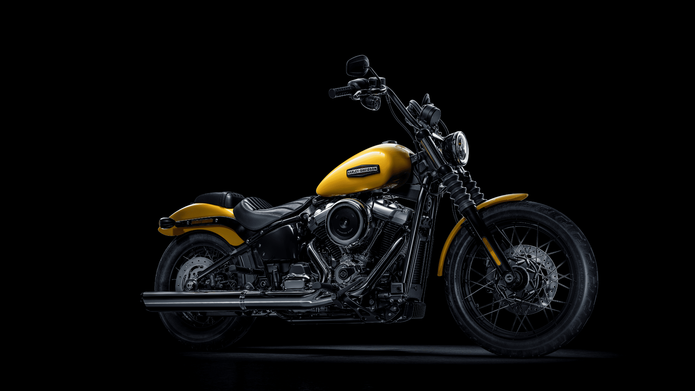 2025 Harley-Davidson® Street Bob® in yellow with solo seat, ape handlebars, and spoked wheels