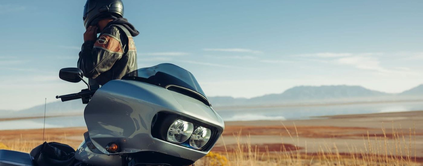 A close up shows the headlight on a silver 2022 Harley-Davidson Road Glide Special.