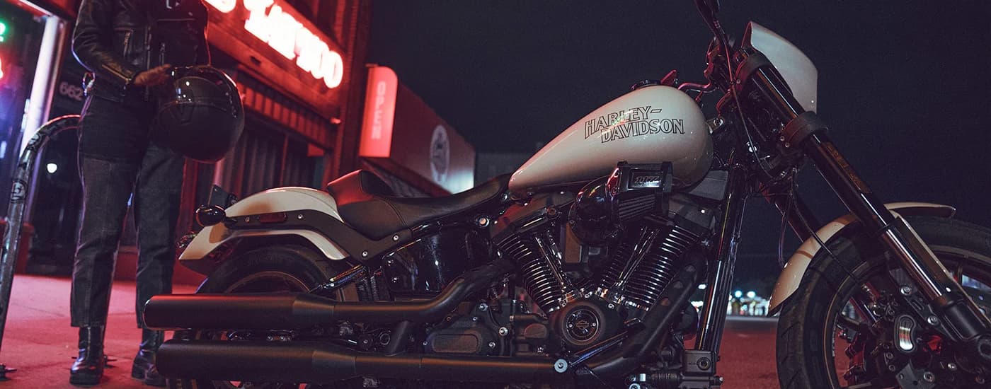A close up of a white 2023 Harley-Davidson Low Rider S is shown parked at night.