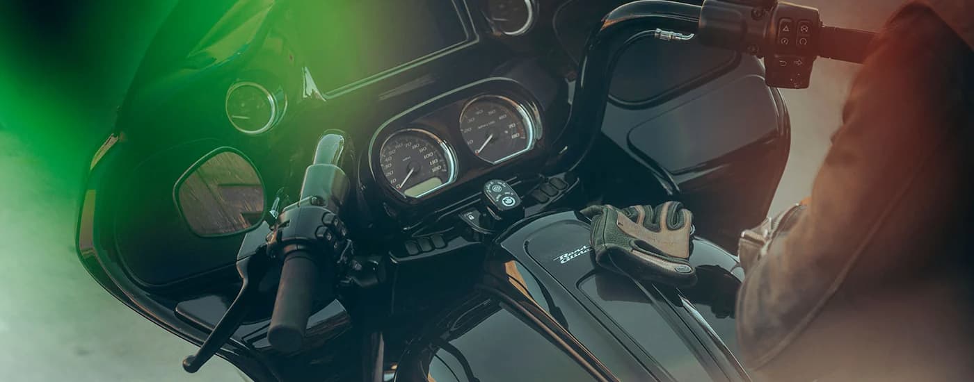 A close up of the gauges on a black 2023 Harley-Davidson Road Glide ST are shown.