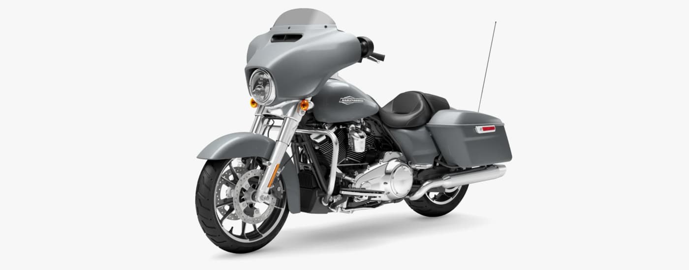 A grey 2023 Harley-Davidson Street Glide is shown angled left.