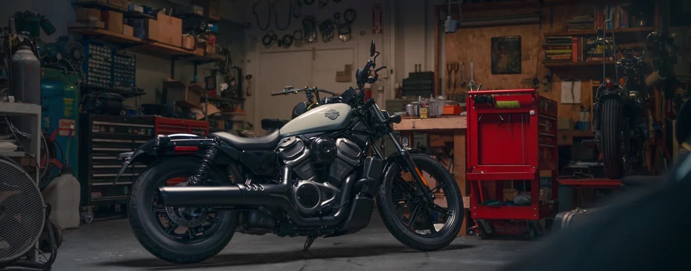 A black and white 2024 Harley-Davidson Nightster is shown parked in a garage.