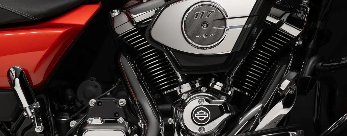A close up of the engine on a red 2024 Harley-Davidson Street Glide.